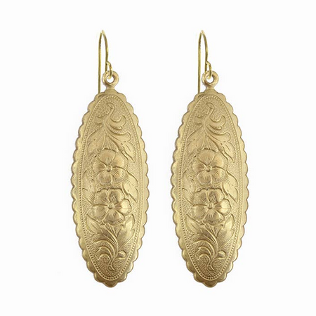Pair of gold earrings with floral patterns on a white background