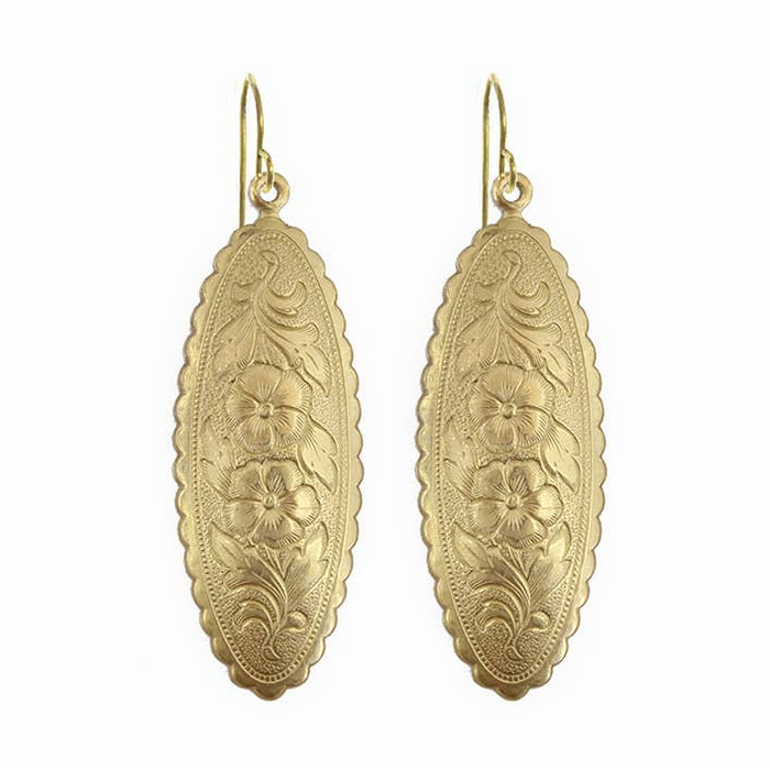 Pair of gold earrings with floral patterns on a white background