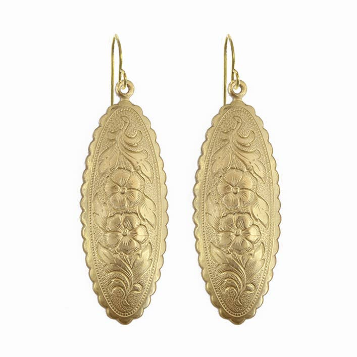 Pair of gold earrings with floral patterns on a white background