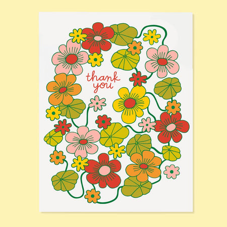 Floral wreath card with 'thank you' text on a yellow background