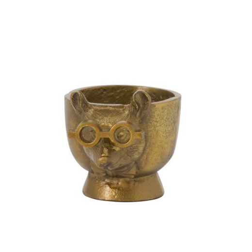 Bronze-colored egg cup with a face design on a white background