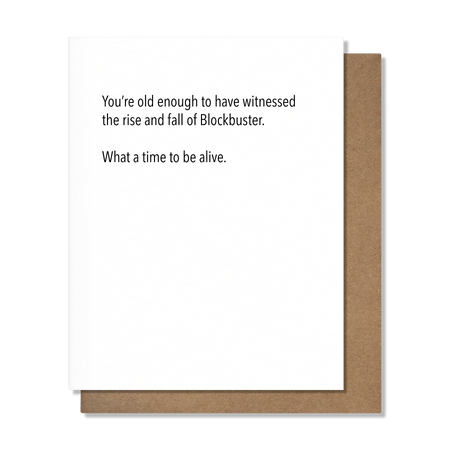 Greeting card with humorous text about Blockbuster on a white background with brown border