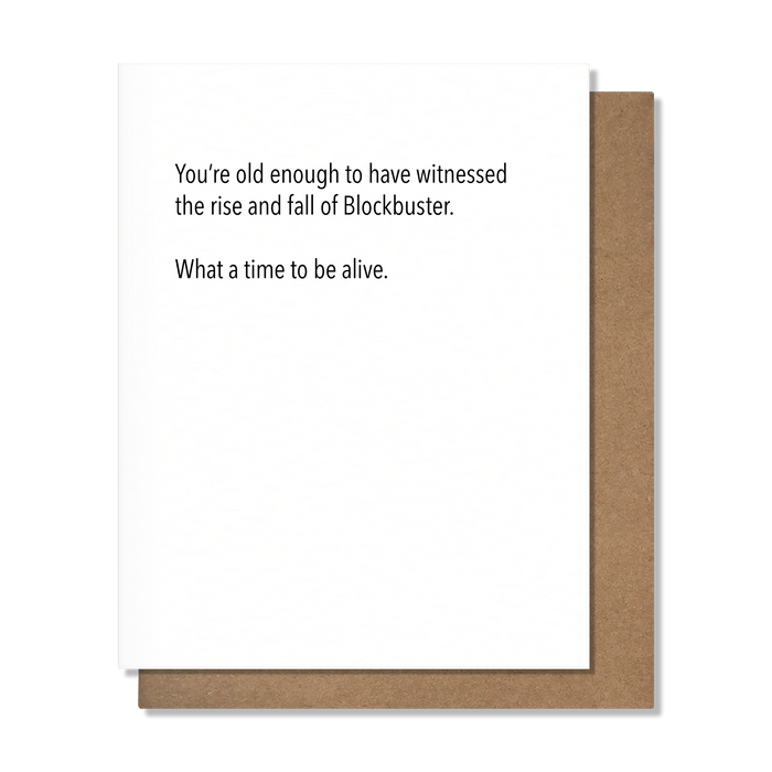Greeting card with humorous text about Blockbuster on a white background with brown border
