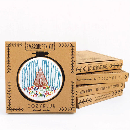 Embroidery kit packaging with 'CozyBlue' branding on a white background