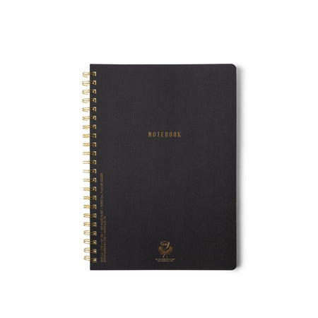 Black notebook with gold spiral binding on a white background