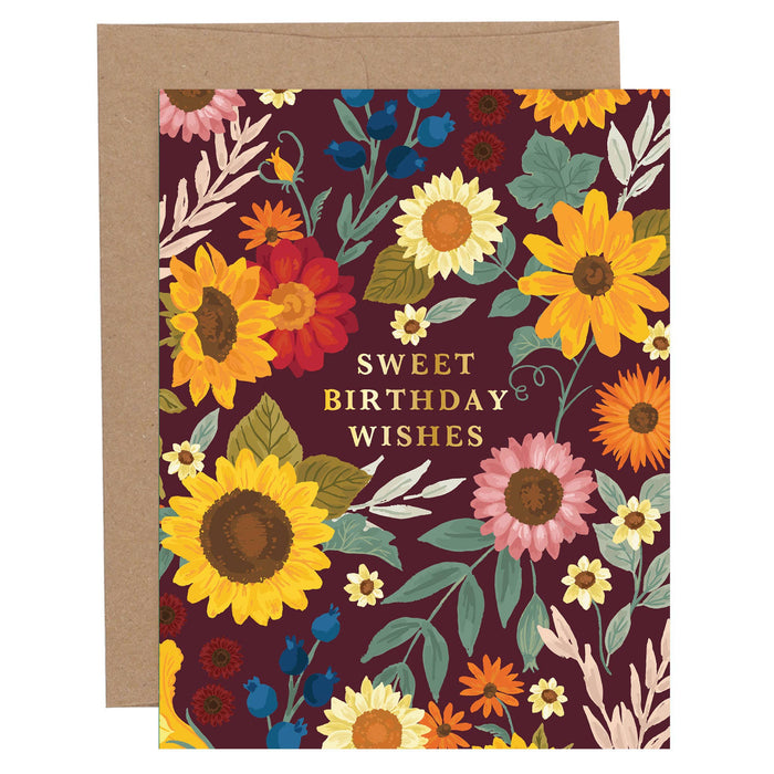 Floral birthday card with sunflowers and leaves on a dark background