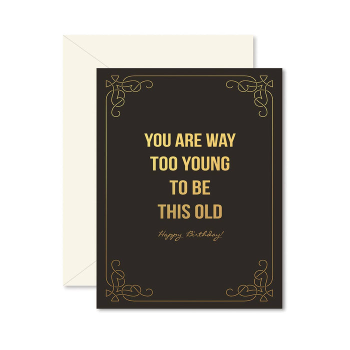 black birthday card with gold foil accents that says 'you are way too young to be this old, happy birthday!'