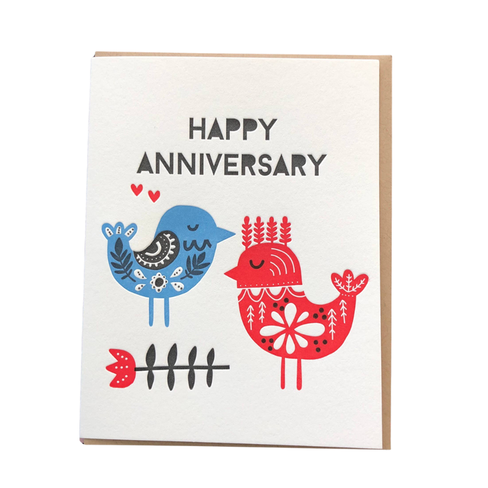 Anniversary card with two birds, one blue and one red, on a white background.