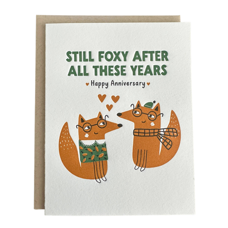 Greeting card with two foxes and anniversary message on a white background