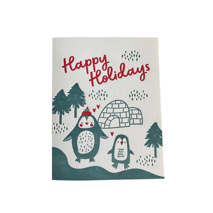 Festive greeting card with penguins, igloo, and 'Happy Holidays' text on a white background