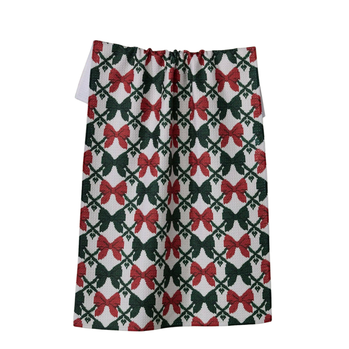 towel with red and green bow pattern on a white background