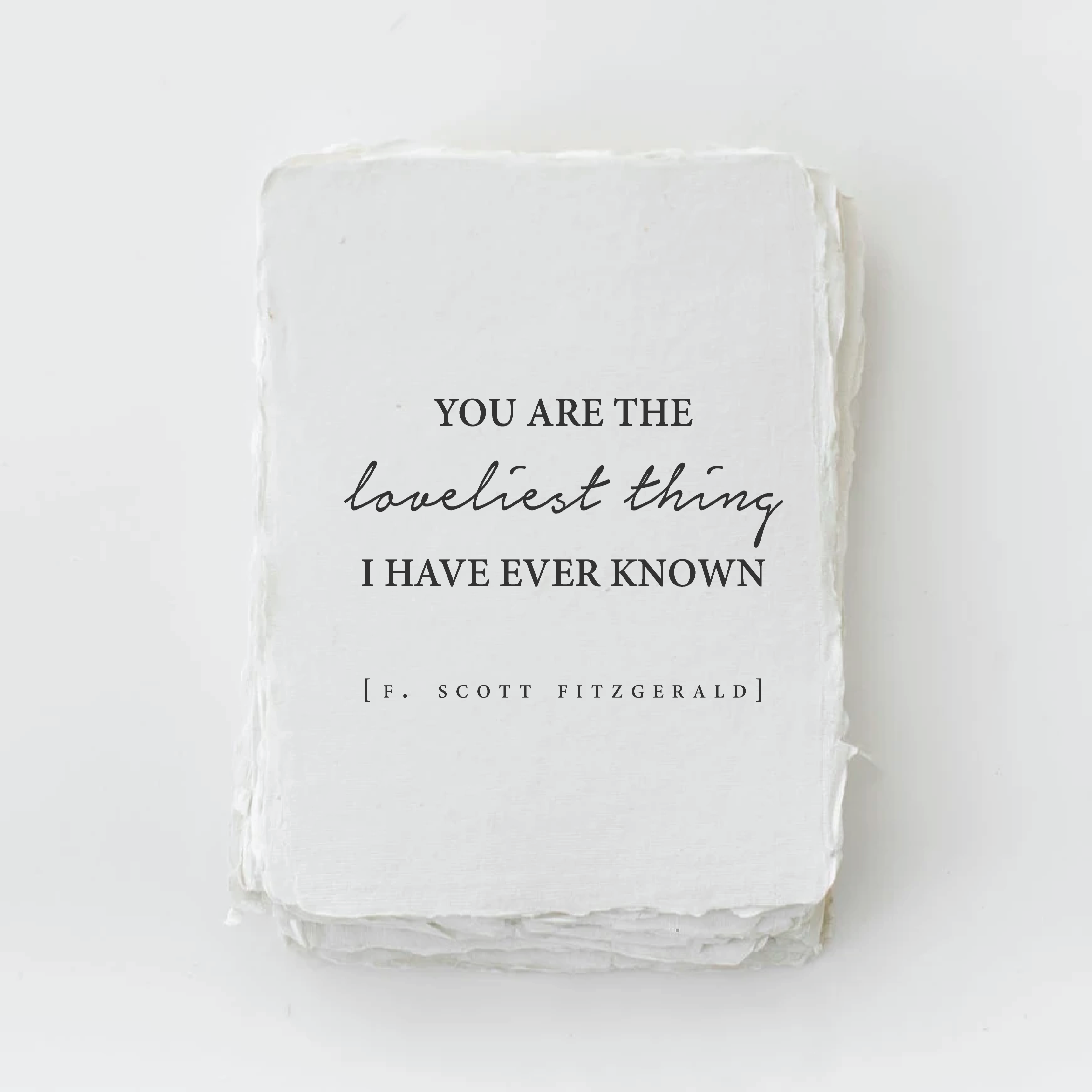 White square with text 'YOU ARE THE loveliest thing I HAVE EVER KNOWN' by F. Scott Fitzgerald on a white background