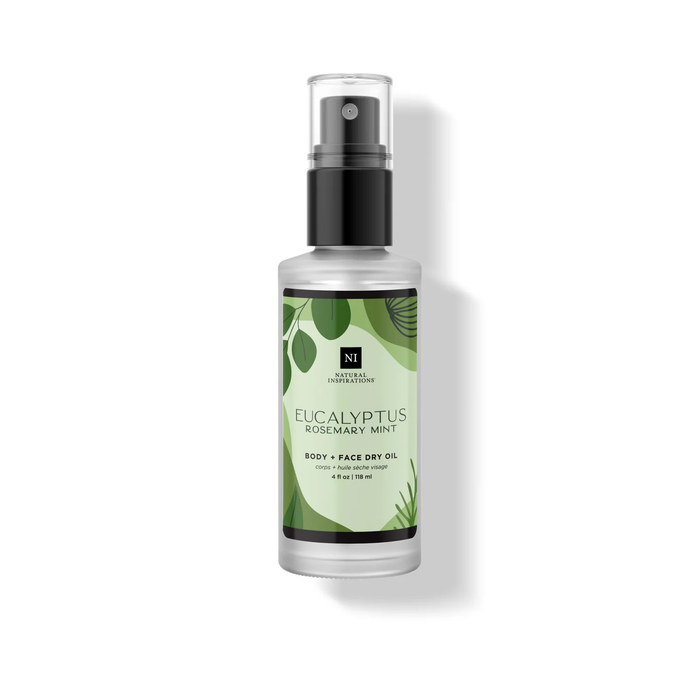 Eucalyptus Rosemary Mint Body + Face Dry Oil in a frosted bottle with a green botanical label and black spray pump