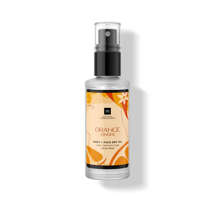 Orange Ginger Body + Face Dry Oil in a frosted bottle with a black pump and orange botanical label