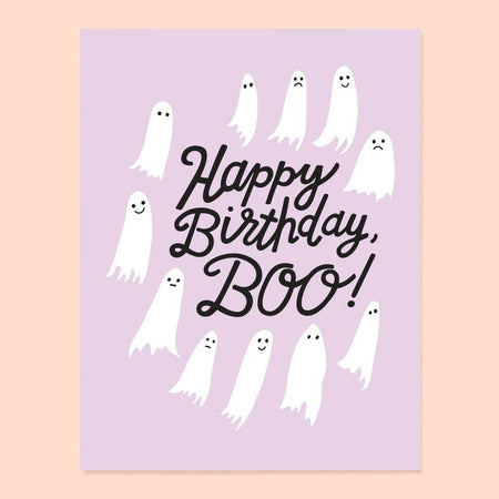 A greeting card with a cartoon illustration of multiple white ghosts surrounding a central 'Happy Birthday' text, with the word 'BOO!' at the end.