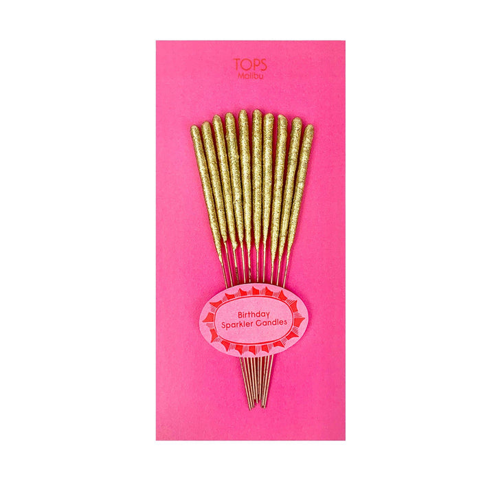 Gold birthday sparkler candles on a pink card with 'Tops' branding.