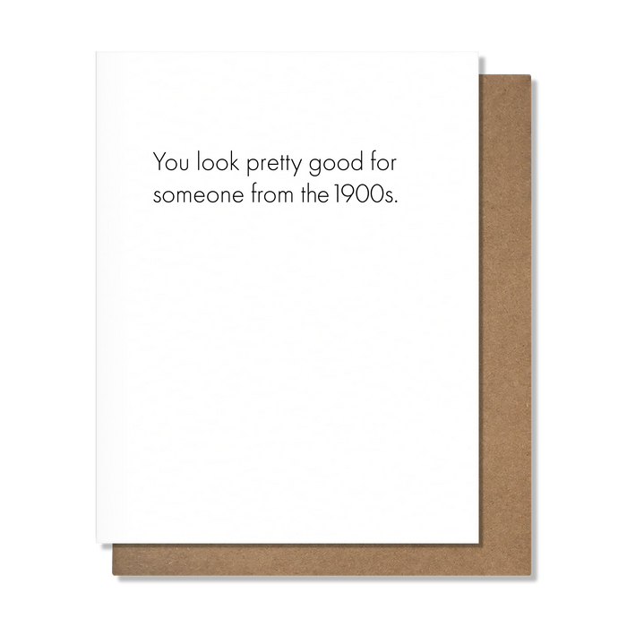 Card with text 'You look pretty good for someone from the 1900s.' on a white background with brown border.