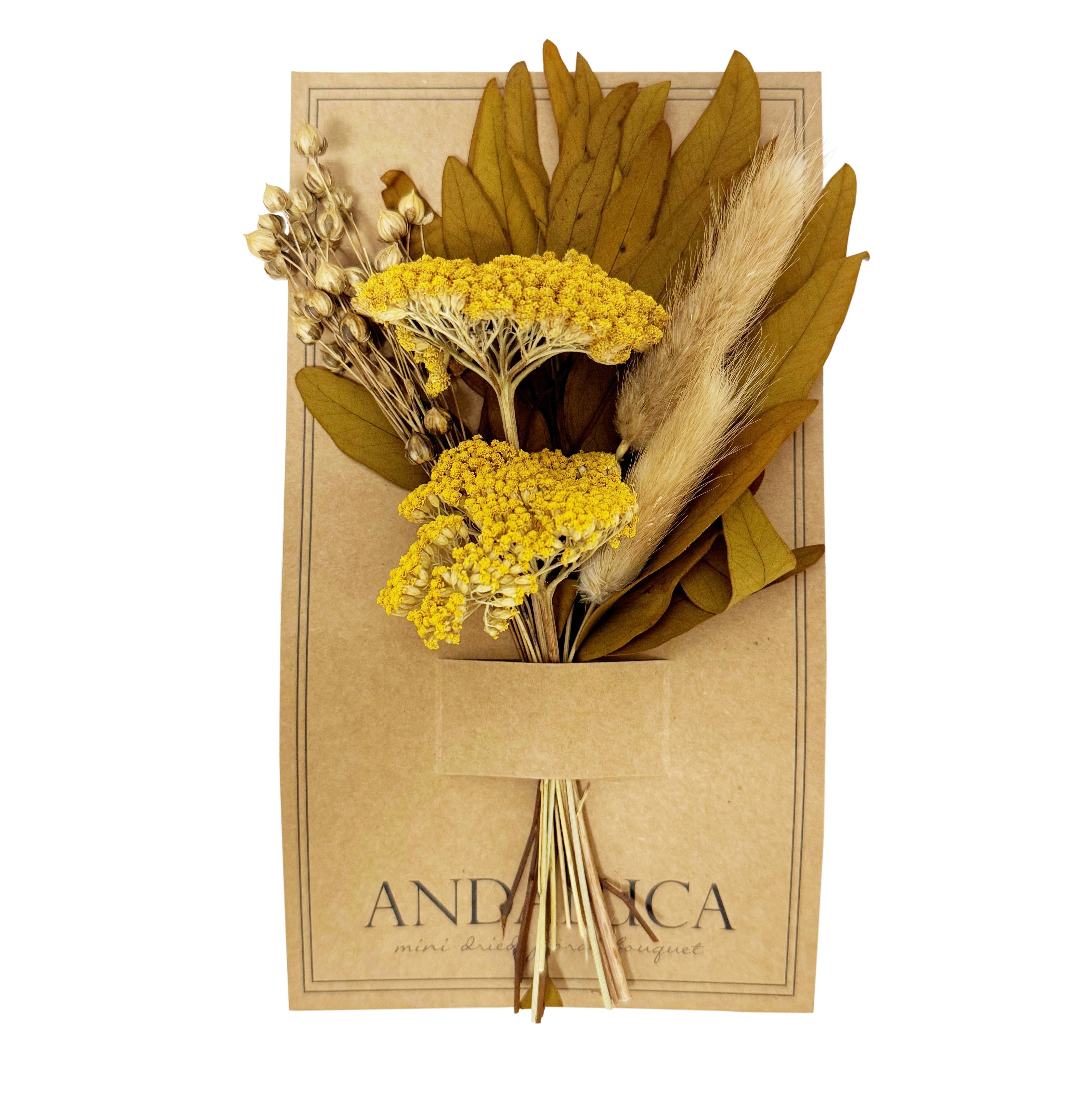 Dried flowers and leaves in a brown paper bag with 'ANDALUCA' branding on a white background