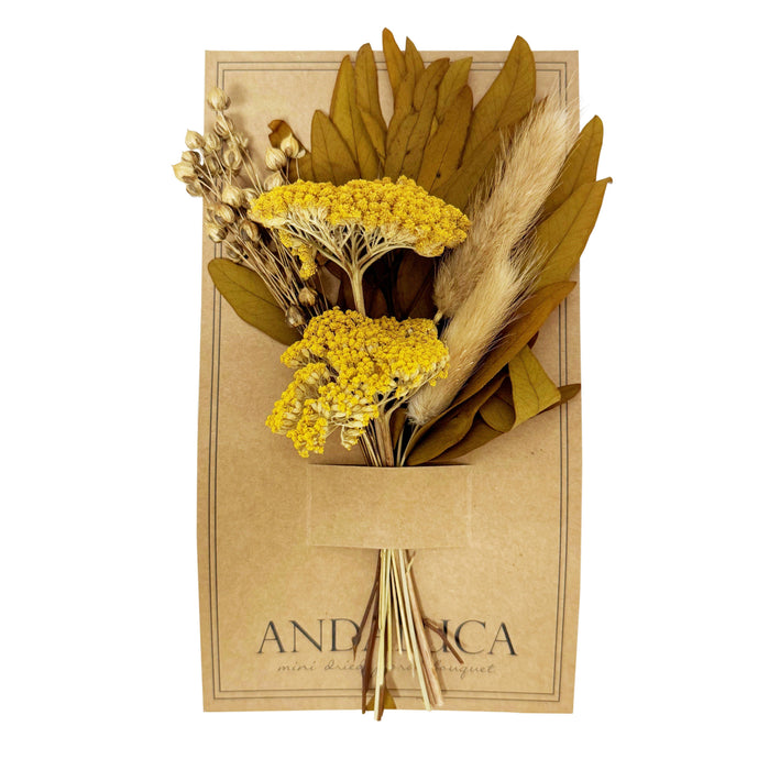 Dried flowers and leaves in a brown paper bag with 'ANDALUCA' branding on a white background