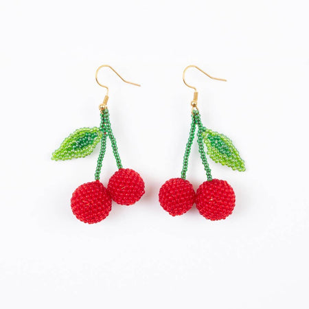 Cherry-themed beaded earrings on a white background