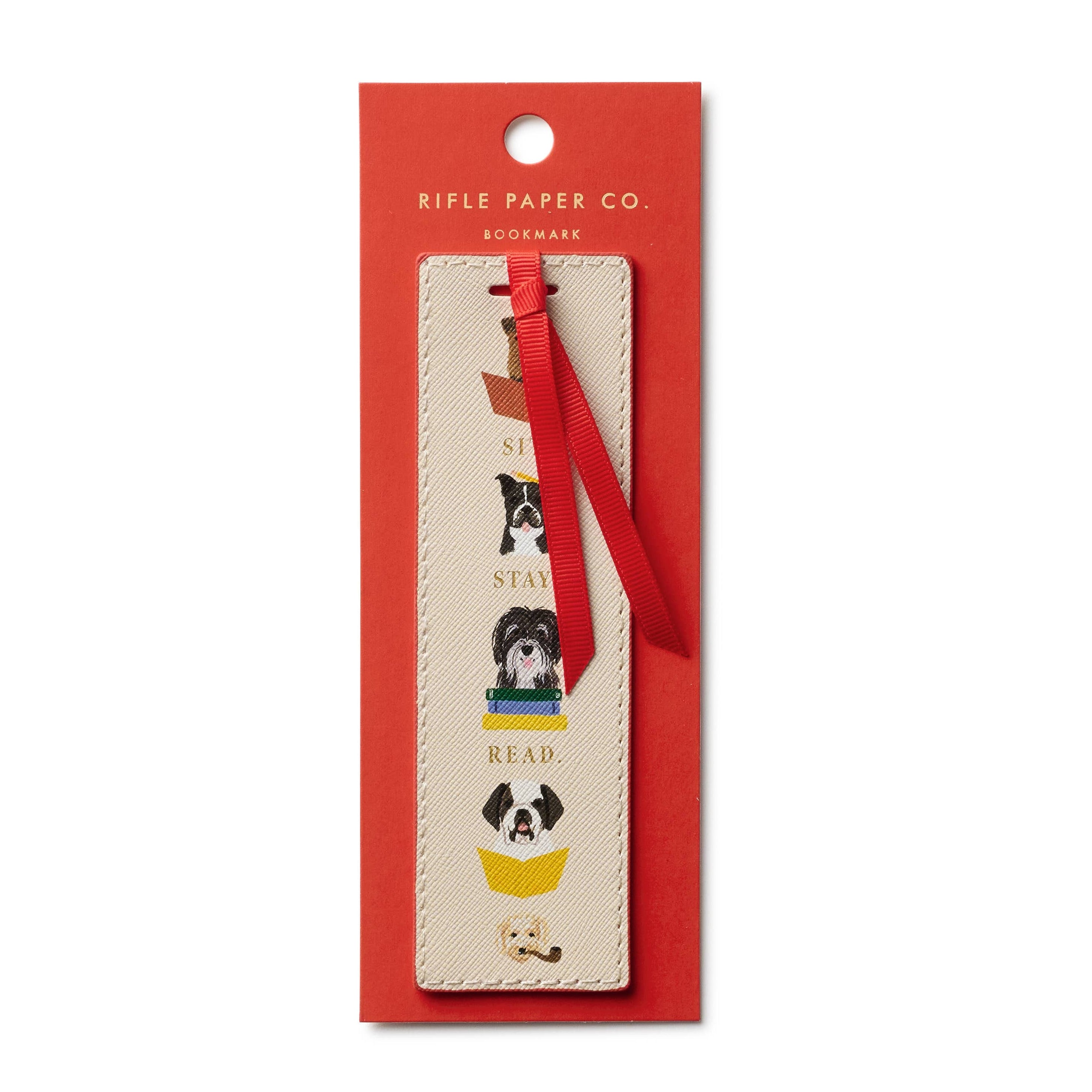 Bookmark with dog illustrations in a red Rifle Paper Co. packaging on a white background