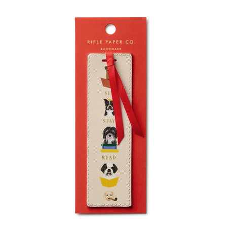 Bookmark with dog illustrations in a red Rifle Paper Co. packaging on a white background