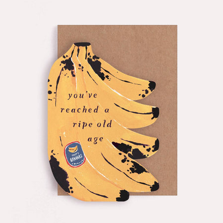 Card with a design of bananas and text on a brown background