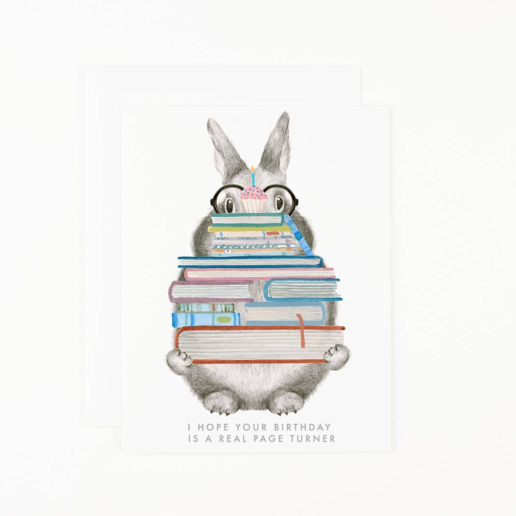 Illustration of a cartoon character with glasses reading books, with text 'I hope your birthday is a real page turner' on a white background.