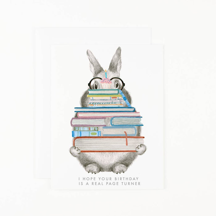 Illustration of a cartoon character with glasses reading books, with text 'I hope your birthday is a real page turner' on a white background.