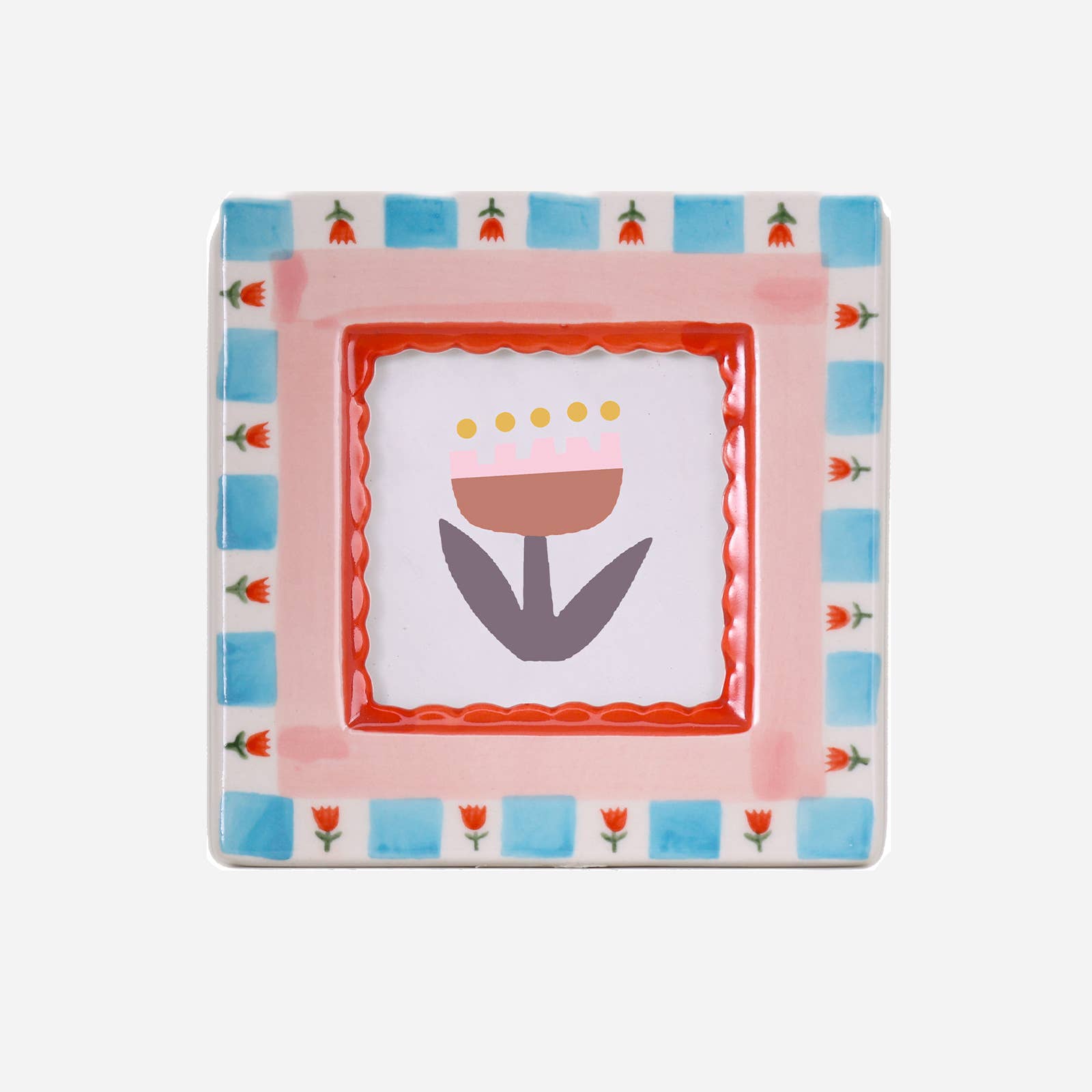 Decorative plate with floral design and colorful border on a white background