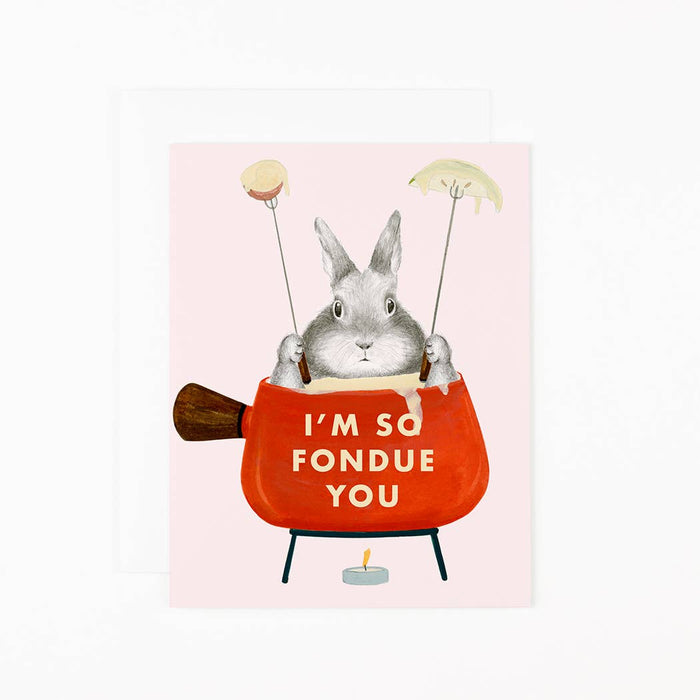 A greeting card with an illustration of a cartoon bunny in a red fondue pot with the text 'I'm So Fondue You' and various fondue accessories like cubes and a flame.