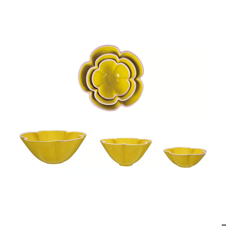 Three yellow flower-shaped bowls of different sizes, with two nested flower-shaped bowls shown at the top and one set of three nested bowls displayed below on a plain white background.