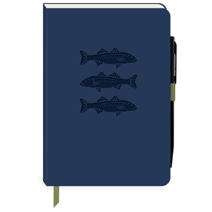 A navy blue hardcover notebook featuring three embossed fish illustrations on the front cover, with a black pen tucked into the side and a matching navy ribbon bookmark hanging from the bottom.