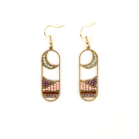 Pair of beaded earrings on a white background