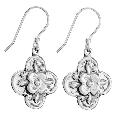 Silver floral earrings on a white background