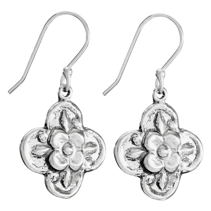 Silver floral earrings on a white background