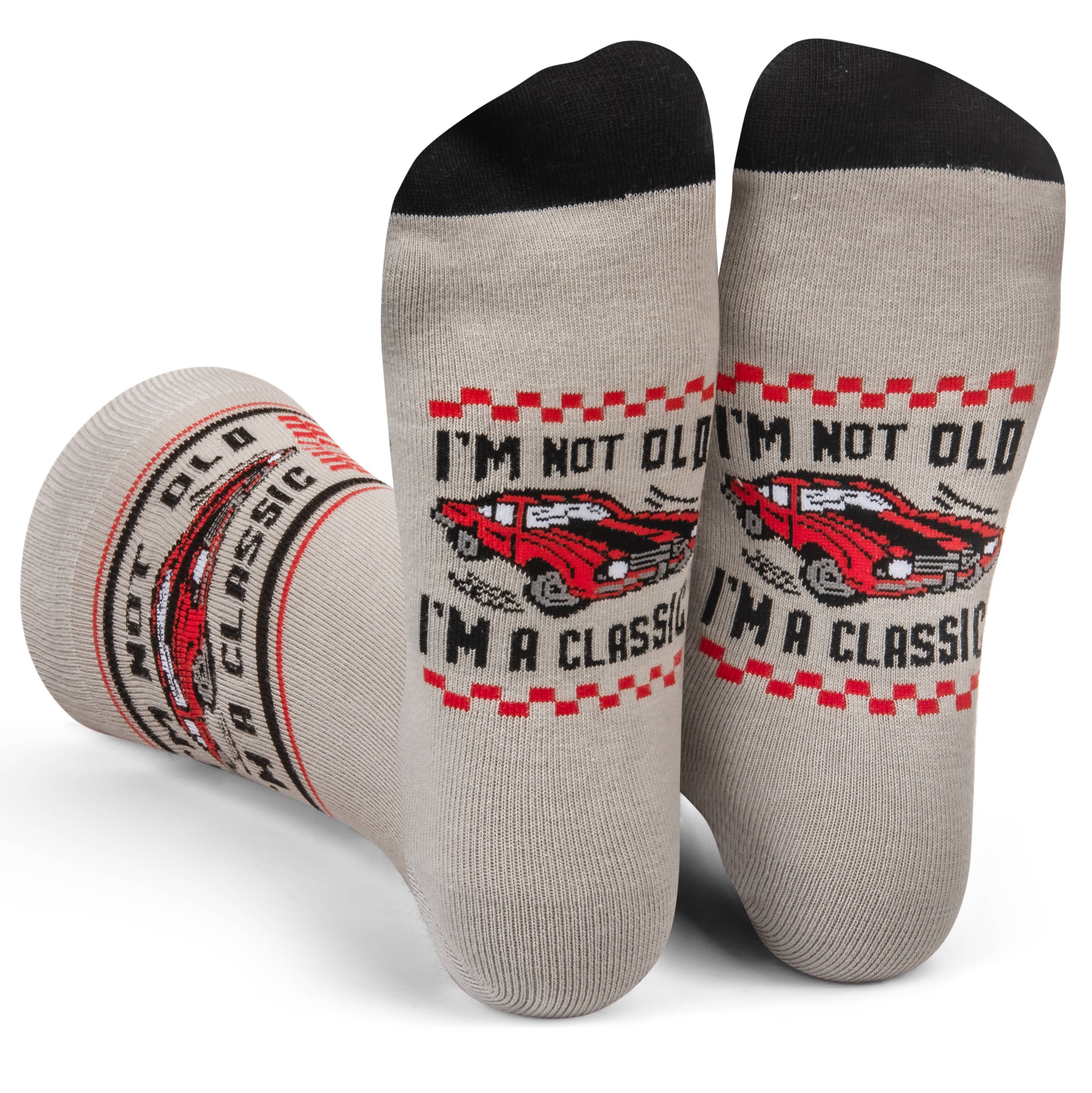 Gray socks with red and black graphics and text on a white background