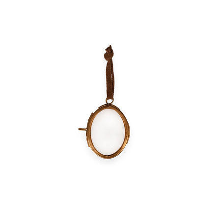 Small oval mirror with a wooden handle on a white background