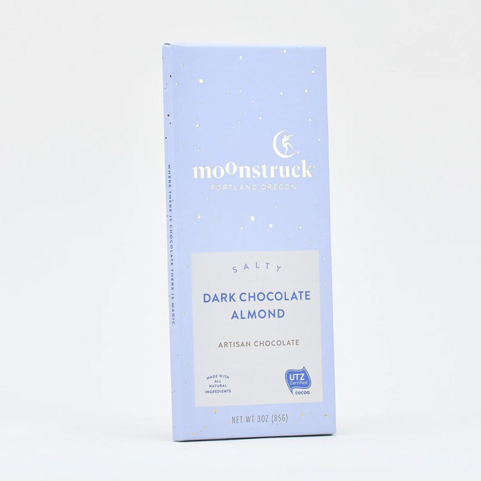 A single Moonstruck Dark Chocolate Almond bar in a light blue paperboard wrapper, photographed against a clean white background.