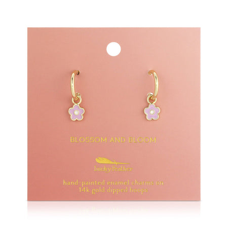 Gold hoop earrings with pink flower charms on a 'Blossom and Bloom' branded card.