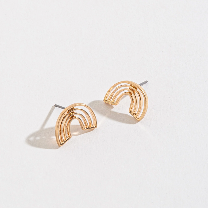 Gold rainbow-shaped earrings on a light gray background
