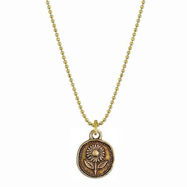 Necklace with a gold chain and bronze pendant featuring a floral design on a white background