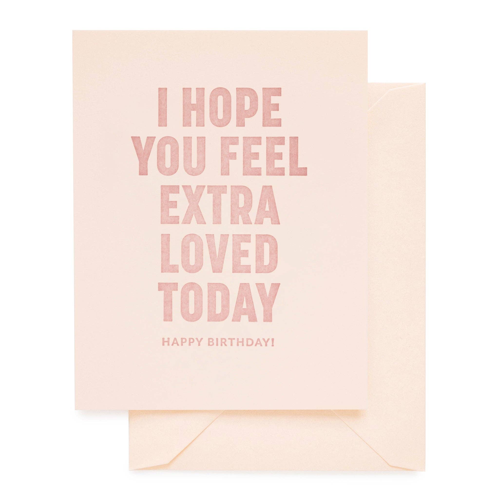 Greeting card with 'I hope you feel extra loved today' text on a matching envelope.