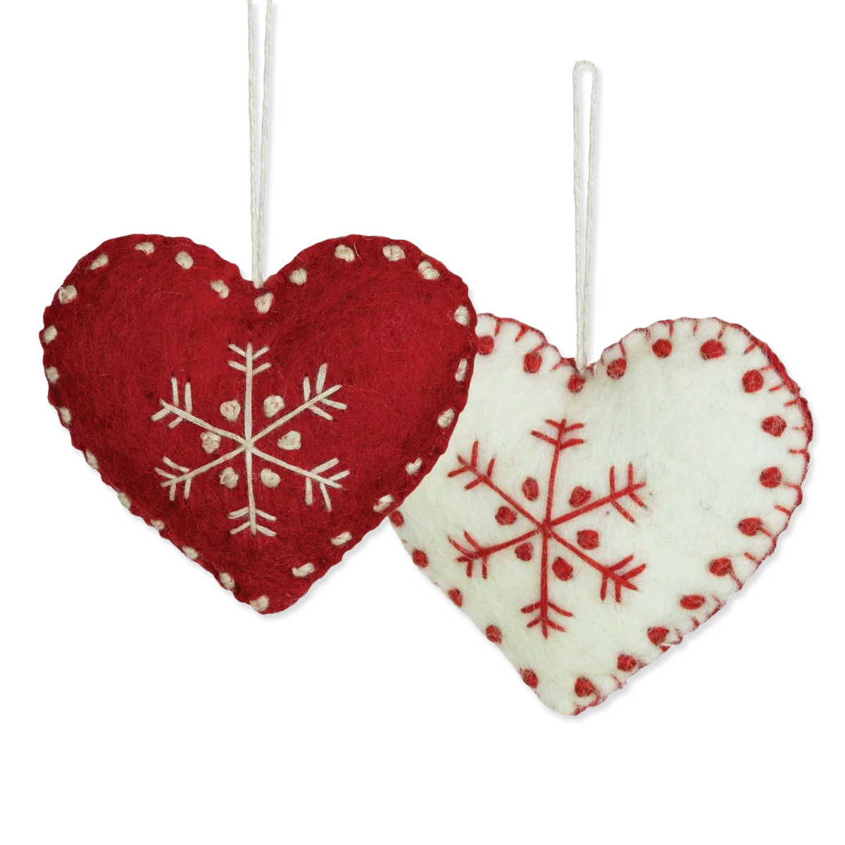 Two heart-shaped ornaments with snowflake patterns on a white background