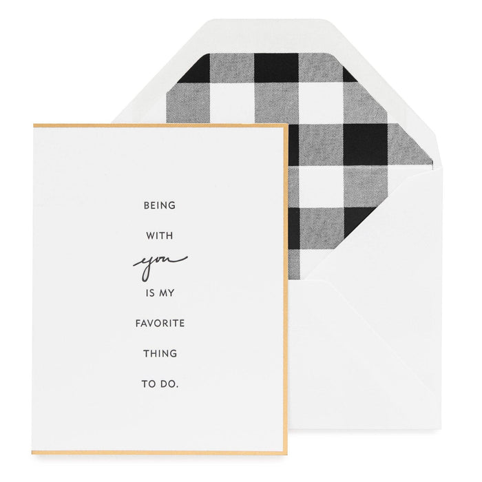 Greeting card with 'Being with you is my favorite thing to do.' text and checkered envelope.