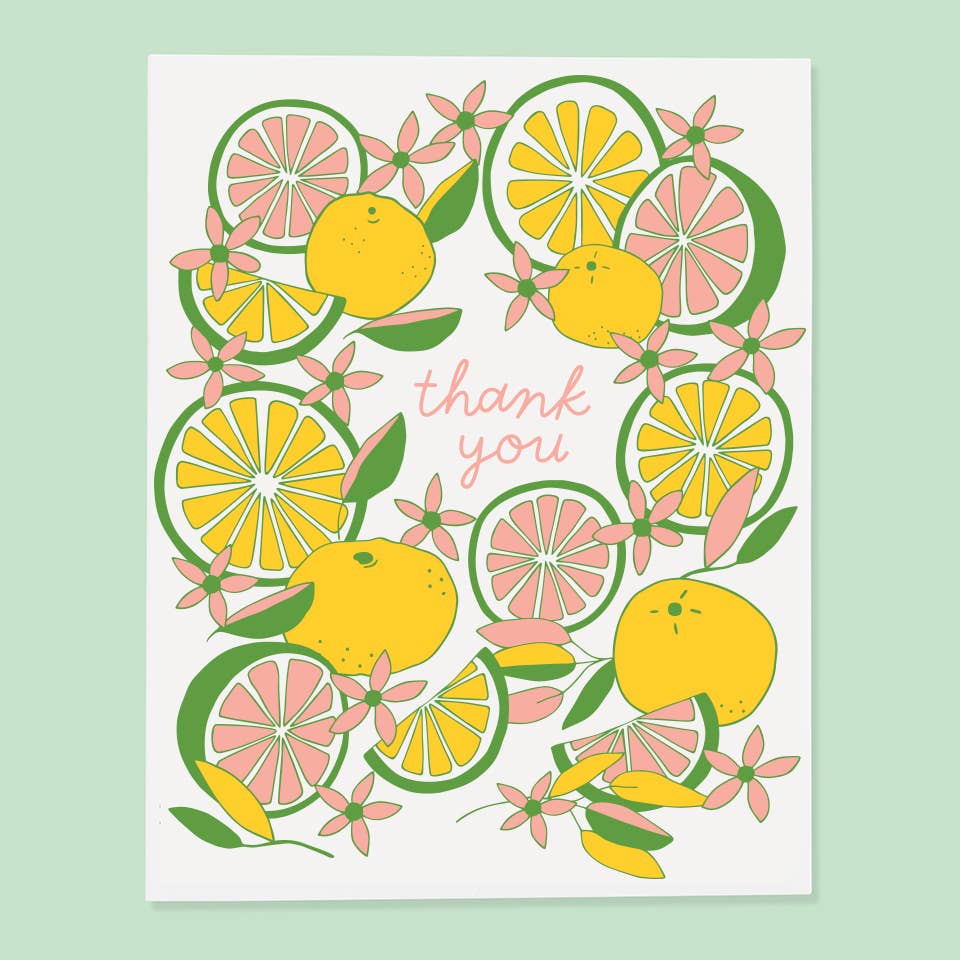 Card with citrus fruit design and 'thank you' text on a light green background