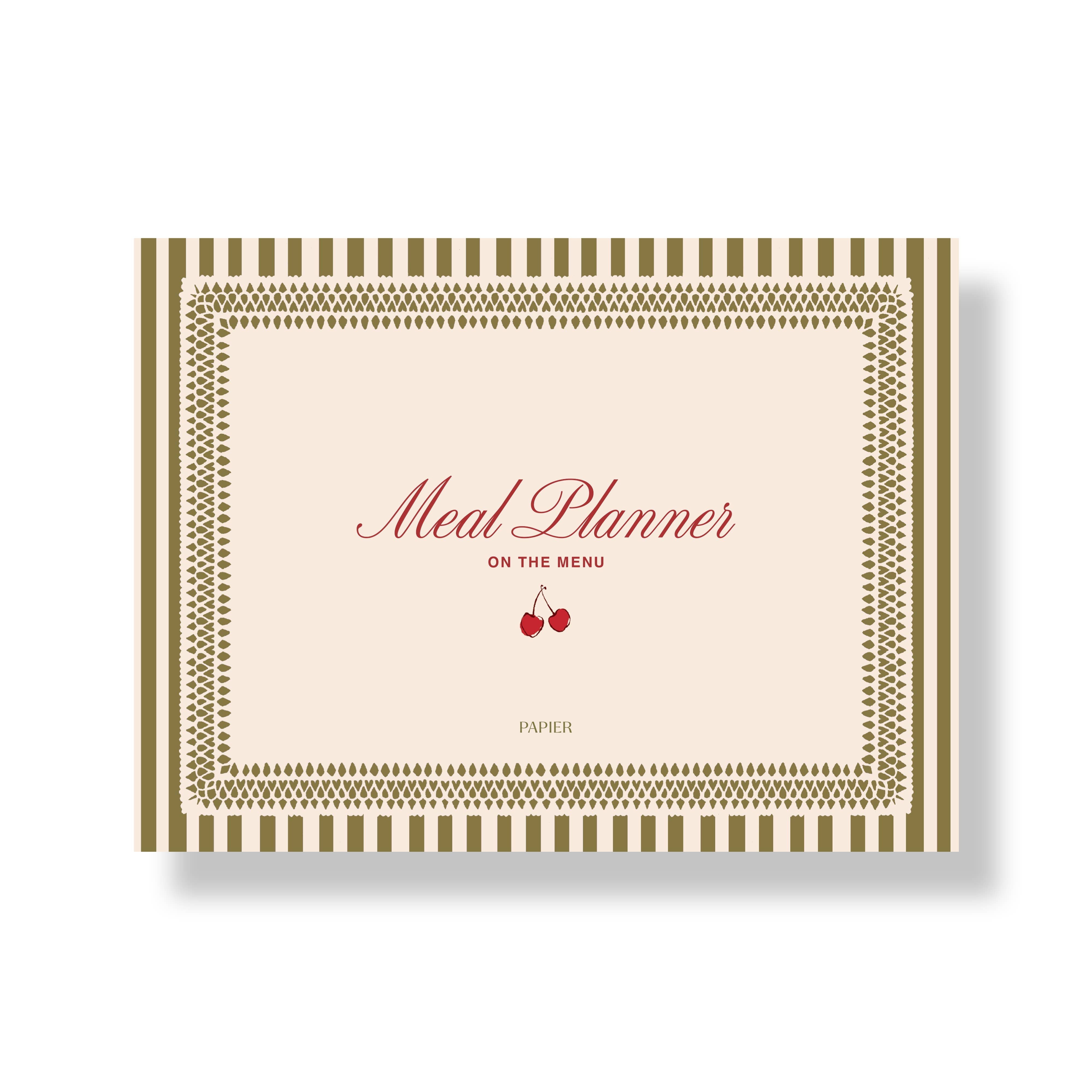 Meal planner book with decorative cover featuring a pair of cherries on a white background