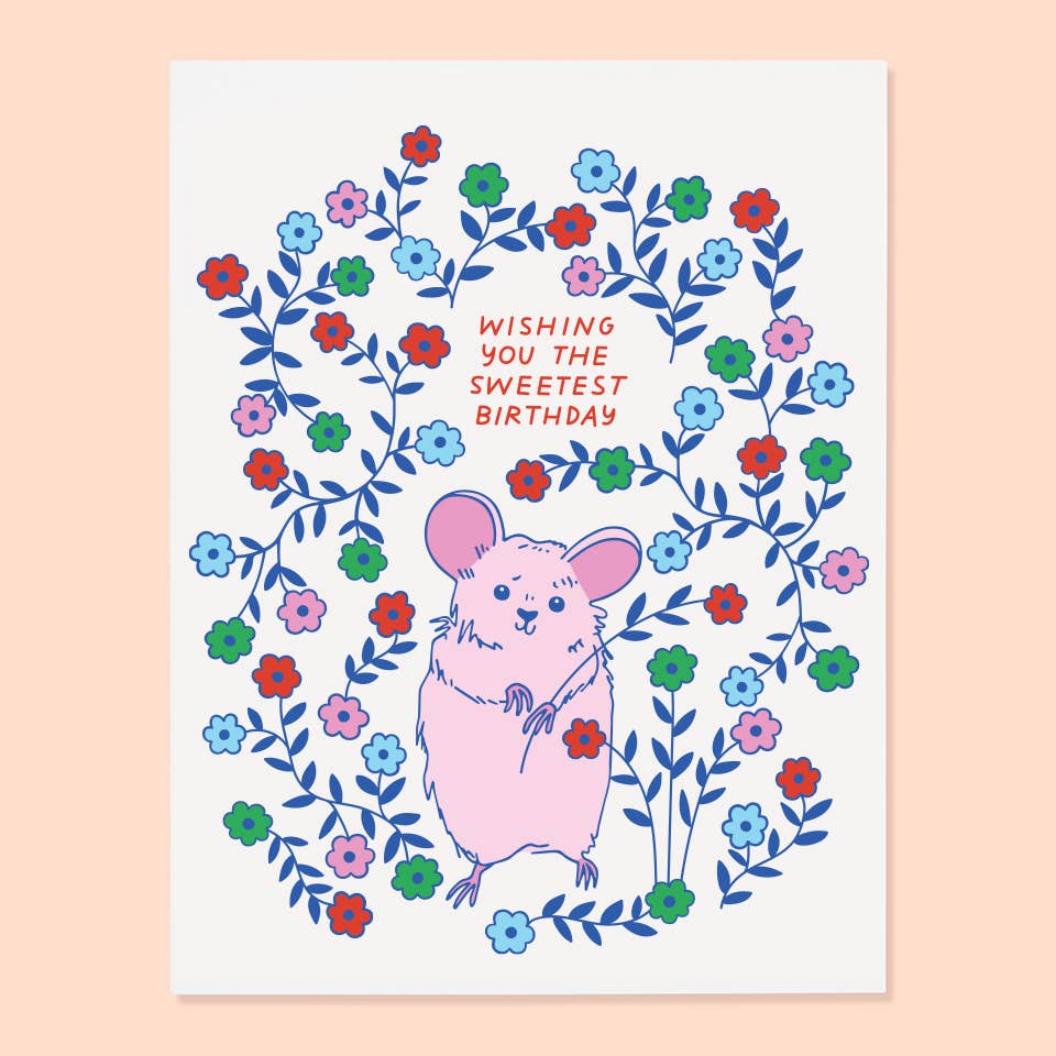 Greeting card with a pink mouse surrounded by colorful flowers and text on a light pink background