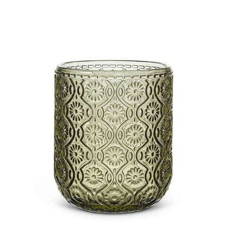 Decorative glass candle holder with intricate patterns on a white background