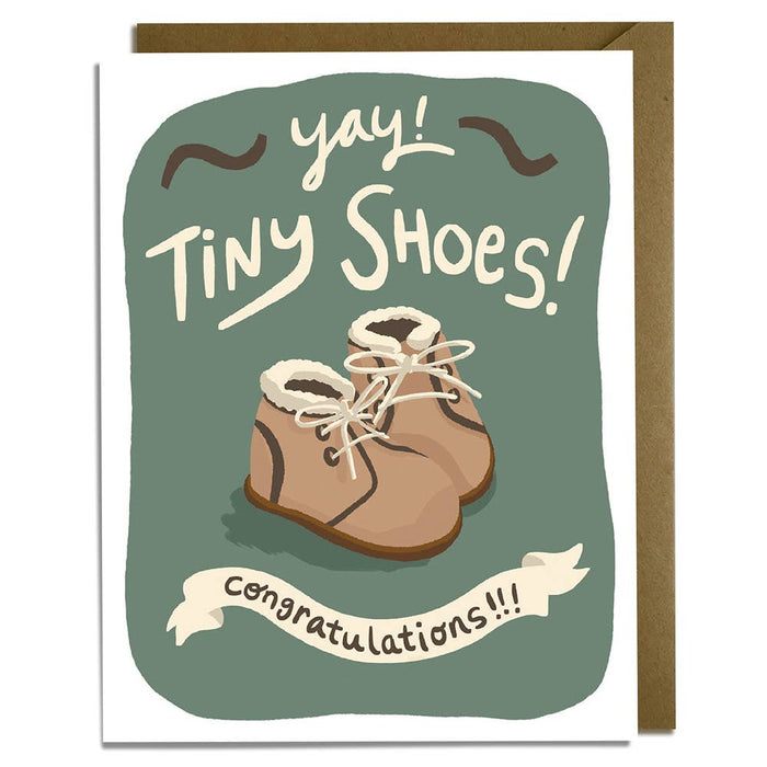 Greeting card with illustration of baby shoes and text 'yay! Tiny Shoes! Congratulations!!!' on a green background.